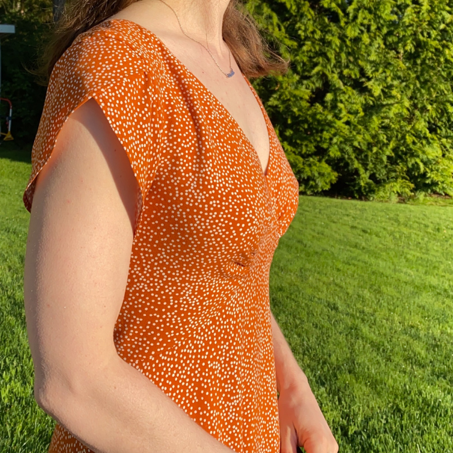Close up of the side view of the dress bodice and self-drafted tulip sleeve