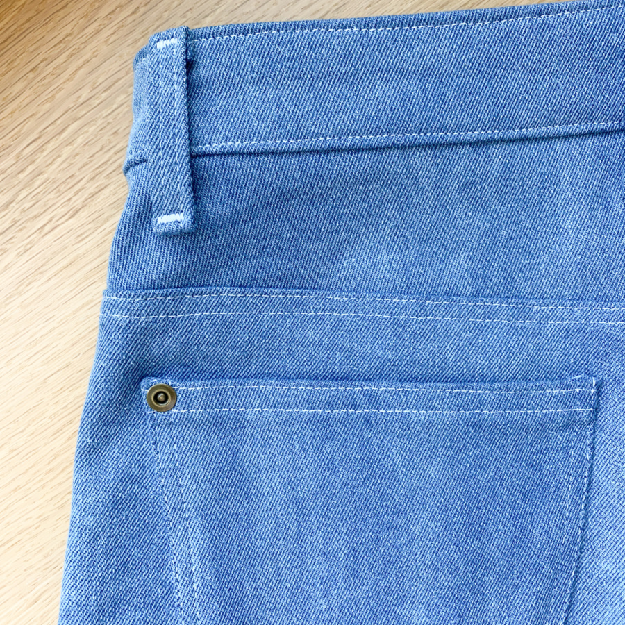 Close up of back pocket and side belt loop