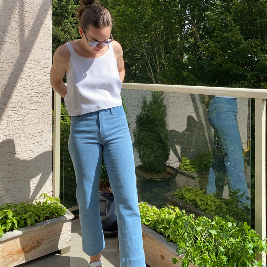 White modified ogden cami and wide leg, light wash ginger jeans, front view